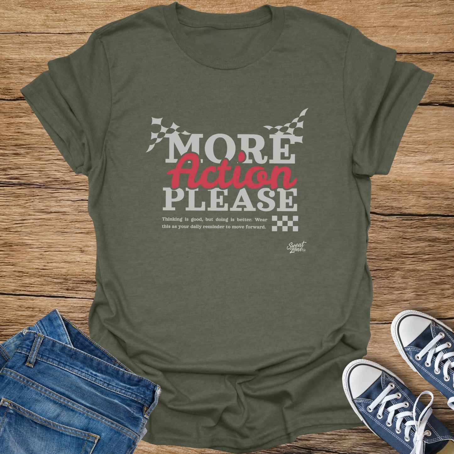 Green t-shirt with "MORE Action PLEASE" text, checkered flags, and a motto.