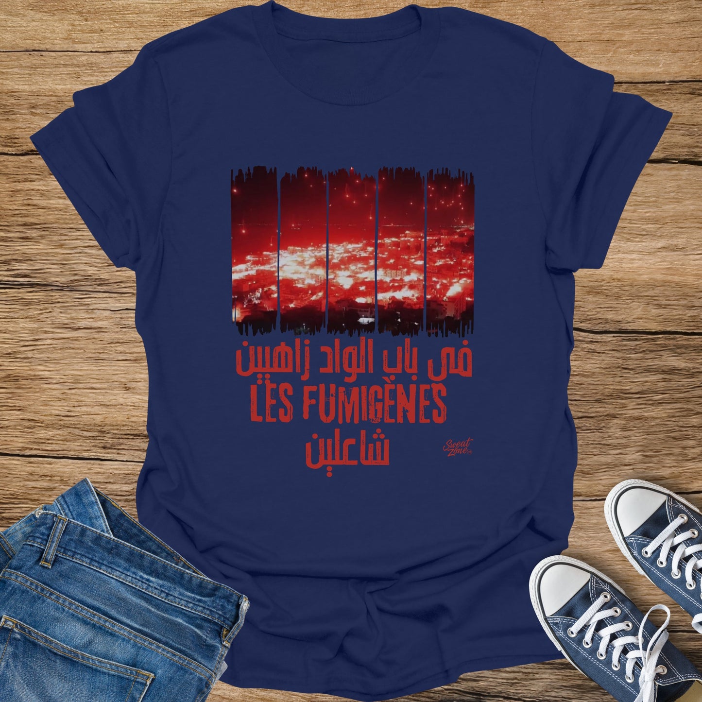 Navy t-shirt with red Arabic text and "LES FUMIGENES" and a silhouette of a city.