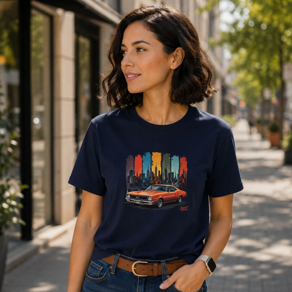 Navy t-shirt with orange muscle car and abstract city skyline graphic.
