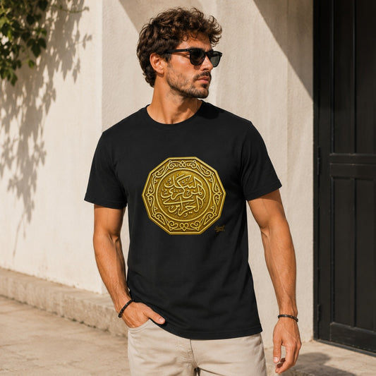 Black t-shirt on man with gold Arabic calligraphy emblem on chest.
