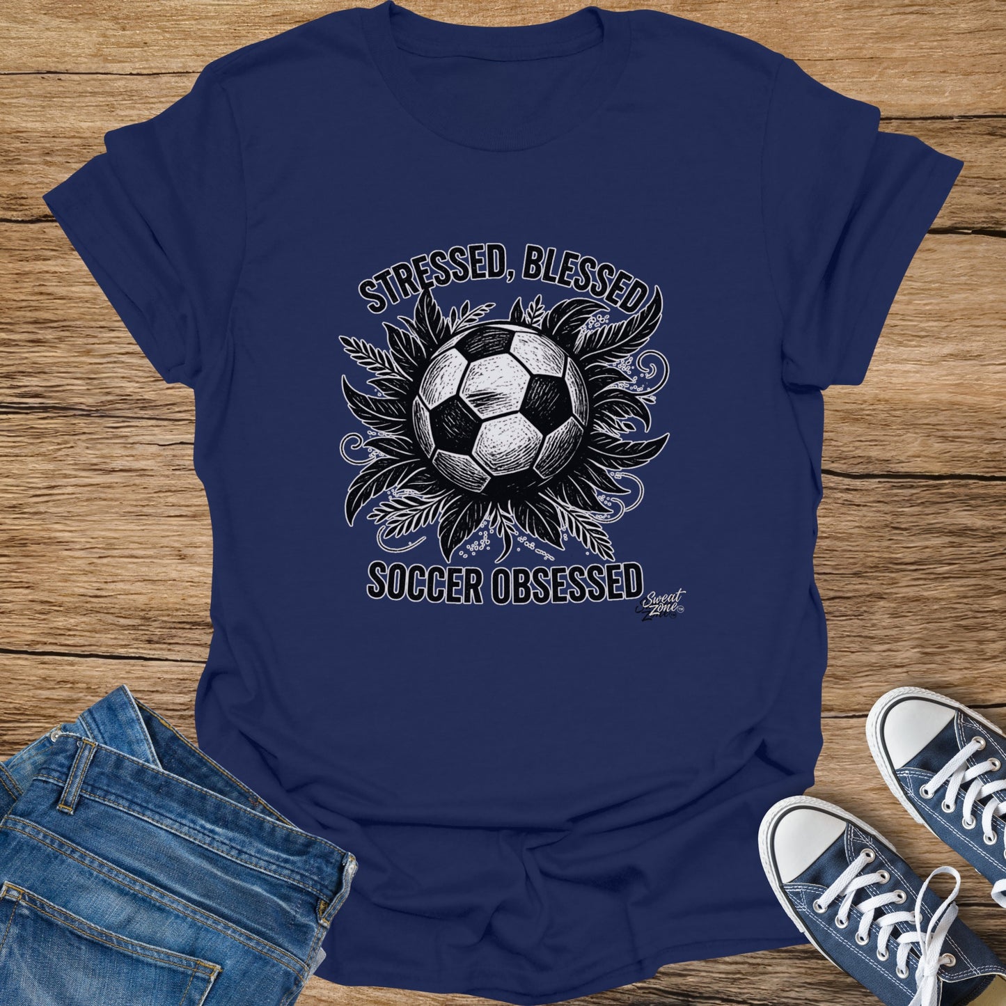 Navy t-shirt with a soccer ball and text "Stressed, Blessed, Soccer Obsessed."