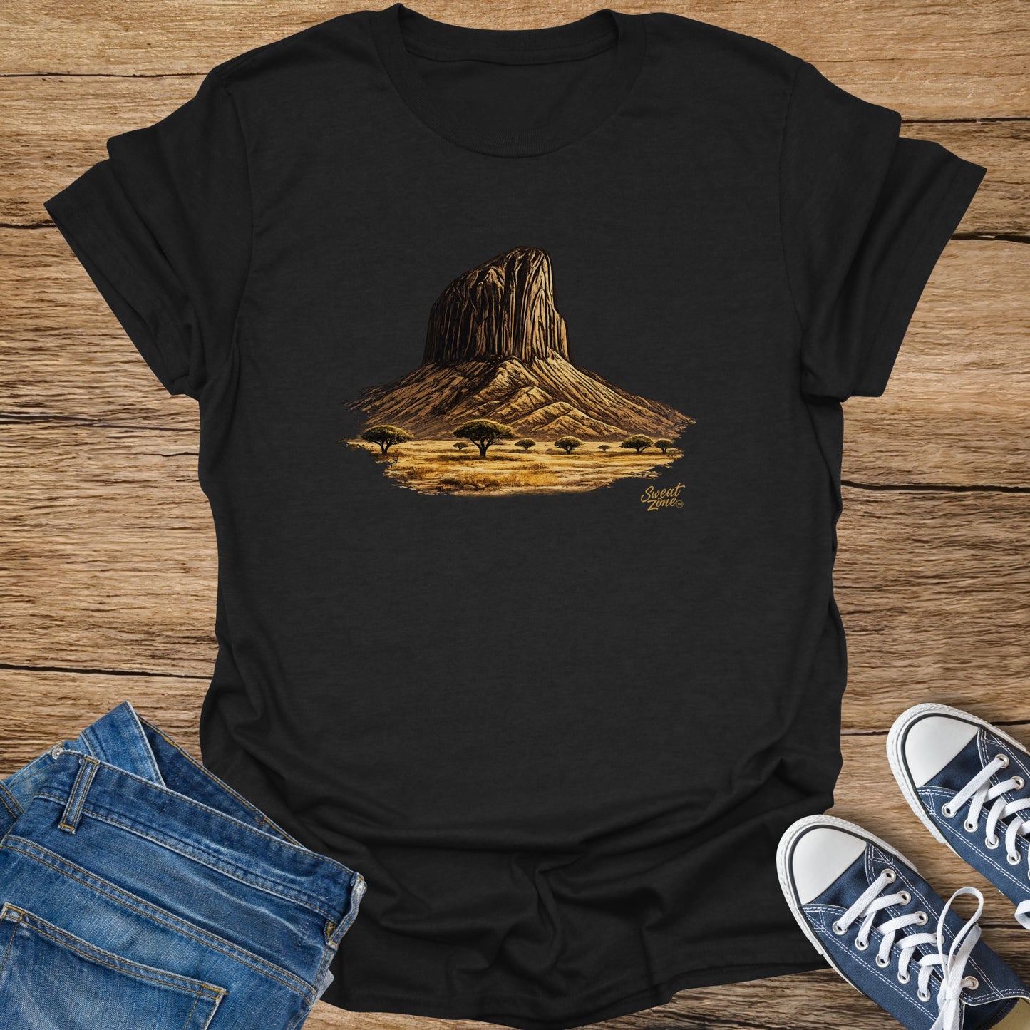 Black t-shirt with desert mesa and trees graphic, "Sweat Zone" logo.