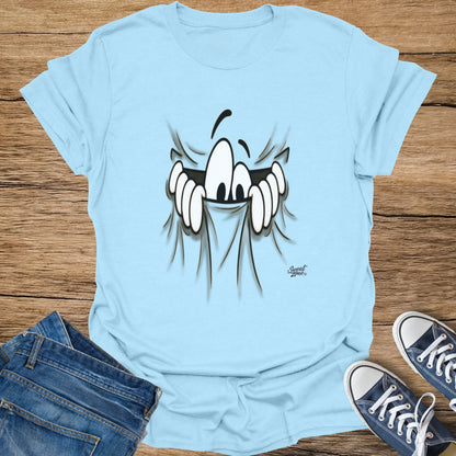 Light blue t-shirt with cartoon eyes peeking through ripped fabric graphic.