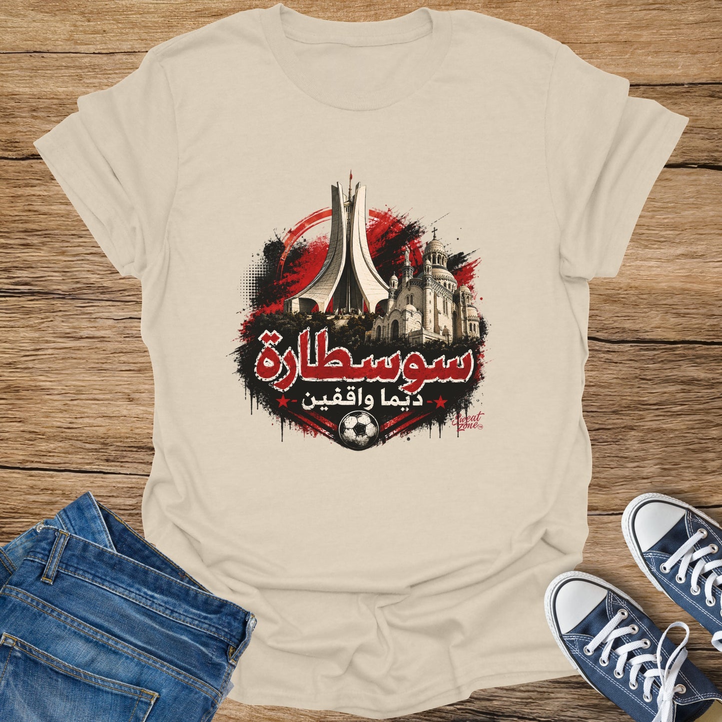 T-shirt with Algiers monuments, Arabic text "سوسطارة", and a soccer ball.
