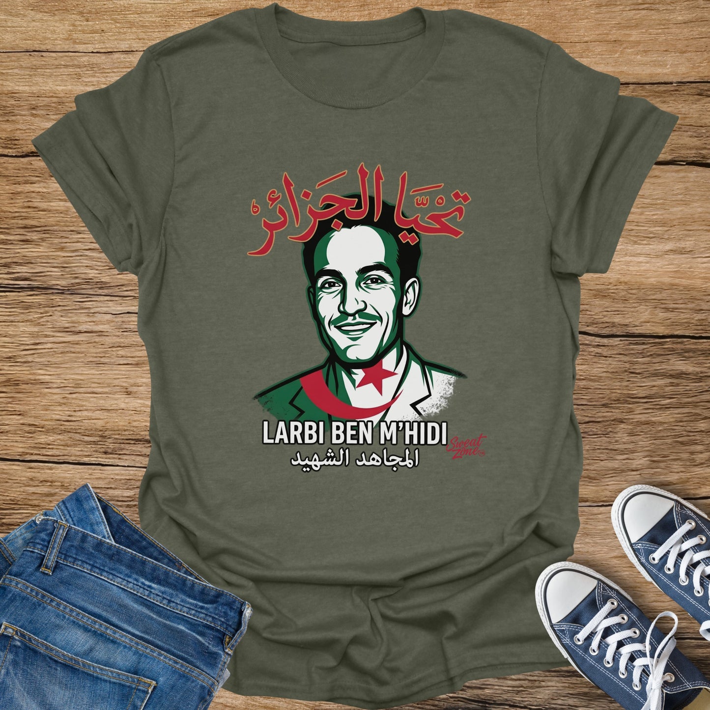 Olive green t-shirt with portrait of Larbi Ben M'Hidi and Arabic text.