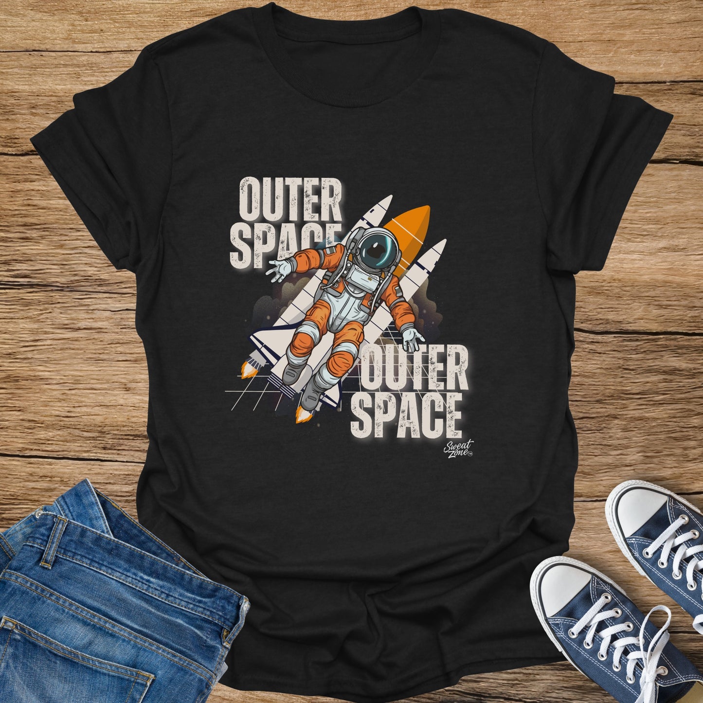 Black t-shirt with astronaut and rockets graphic, "Outer Space" text.