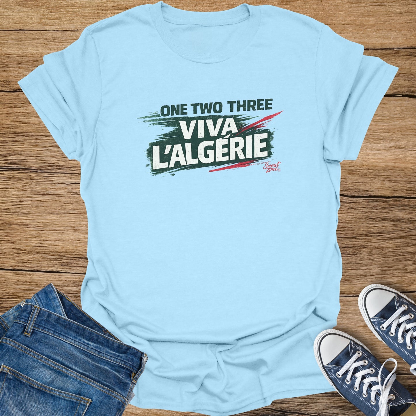 Light blue t-shirt with "ONE TWO THREE VIVA L'ALGERIE" text and small French flag detail.