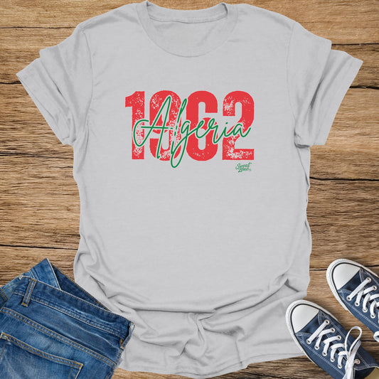 Grey t-shirt with "1962 Algeria" printed in distressed red and green.