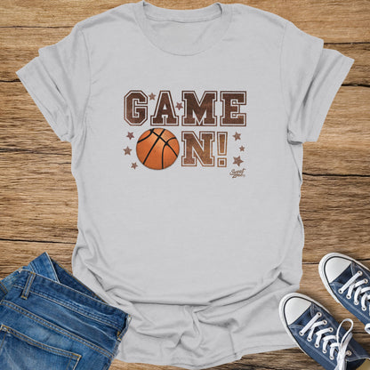 T-shirt with "GAME ON!" text, basketball, and stars graphic.