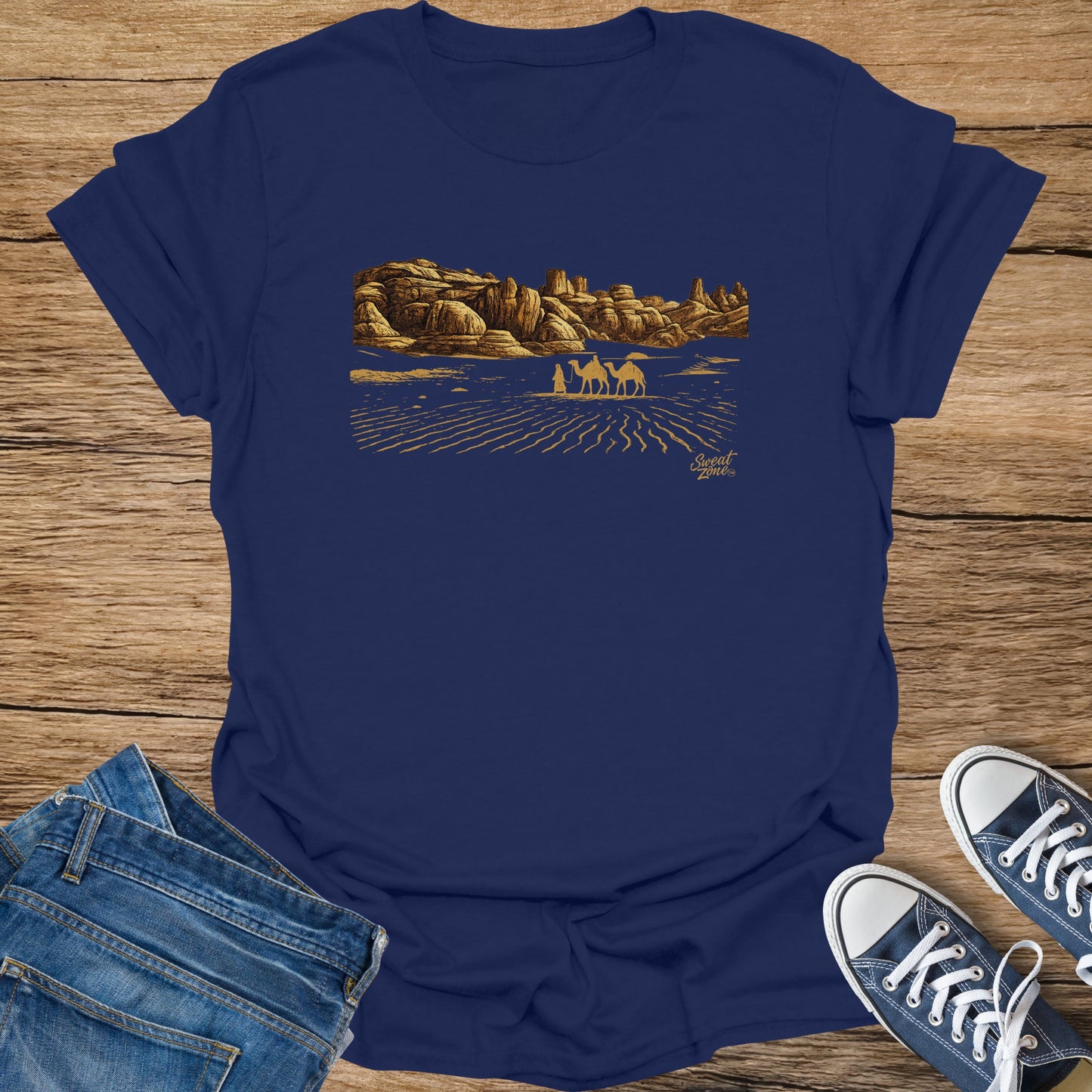 Navy t-shirt with gold desert landscape print and "Sweat Zone" logo.