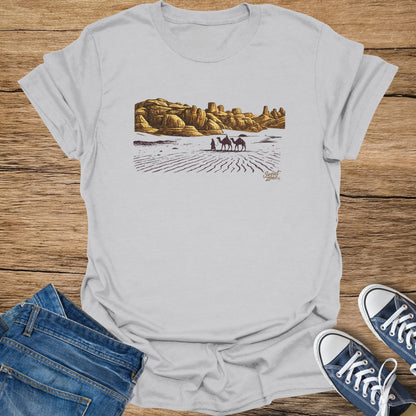 T-shirt with desert landscape, camels, and "Sweat Zone" text at bottom right.