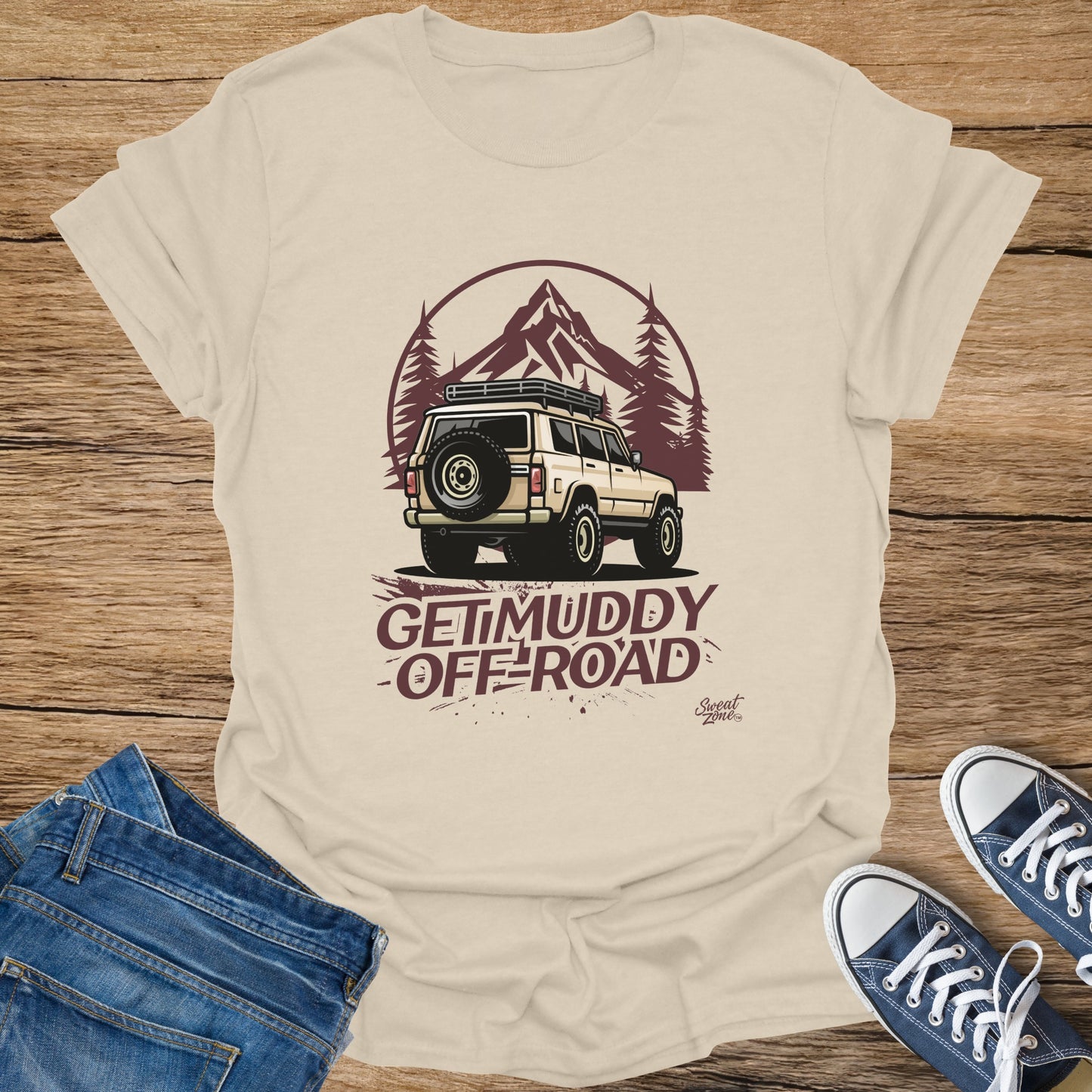 T-shirt with graphic of SUV in mountains and text "GET MUDDY OFF-ROAD"