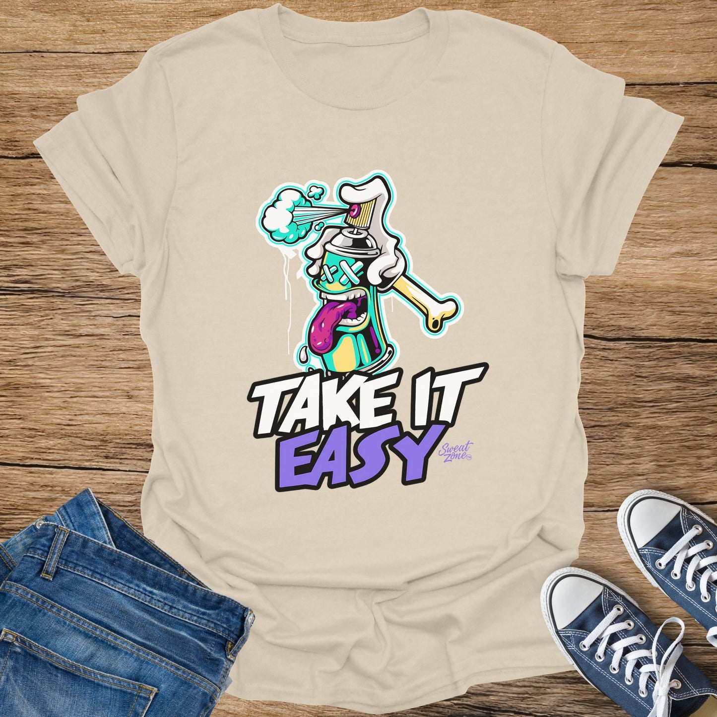 T-shirt with cartoon spray can and "TAKE IT EASY" text.