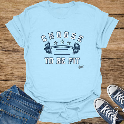 Light blue t-shirt with "CHOOSE TO BE FIT" text and barbell graphic.
