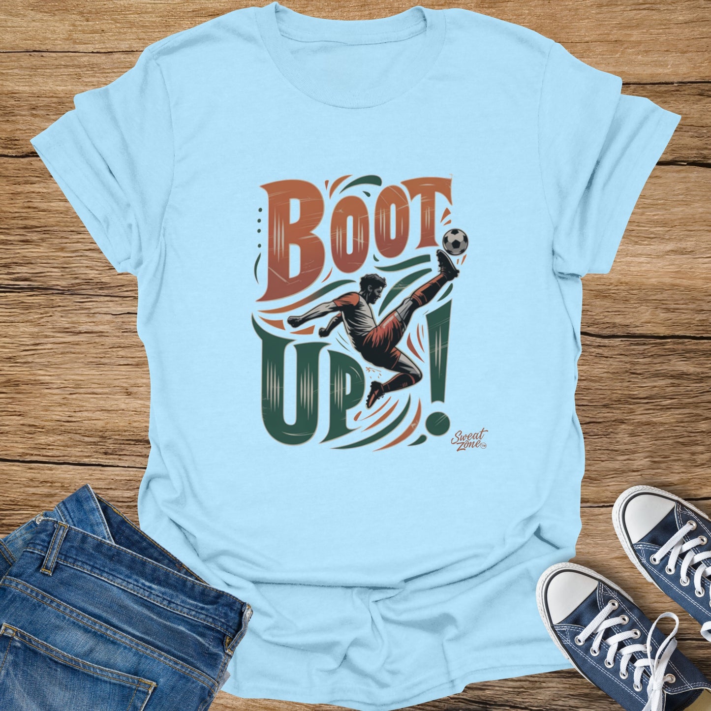 Light blue t-shirt with "BOOT UP!" text and a soccer player kicking a ball.