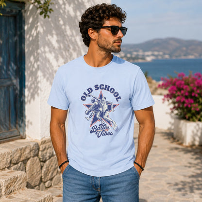 Man in light blue t-shirt with "Old School Batter Vibes" graphic.
