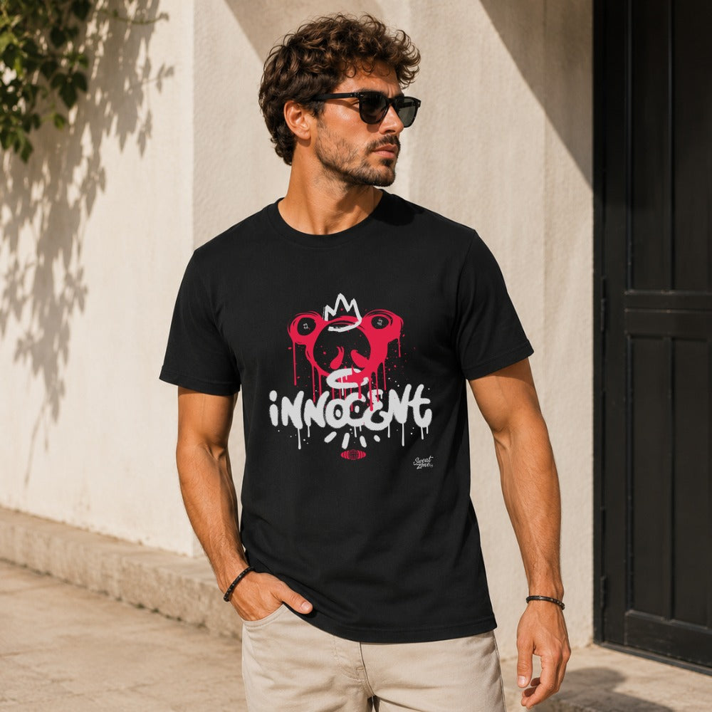 Black t-shirt with a pink and white graffiti-style design of a crowned monkey face with the word "innocent".