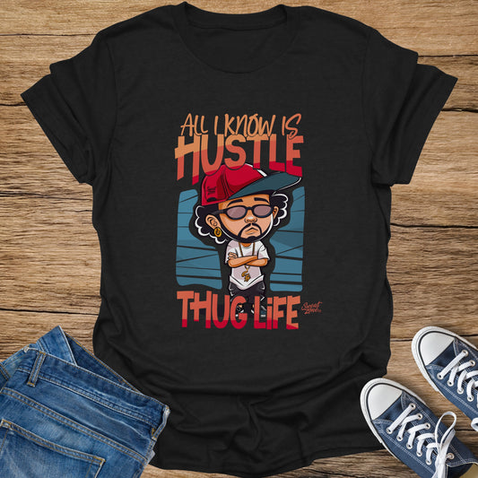 Black t-shirt with graphic featuring cartoon character and text "All I Know Is Hustle Thug Life".