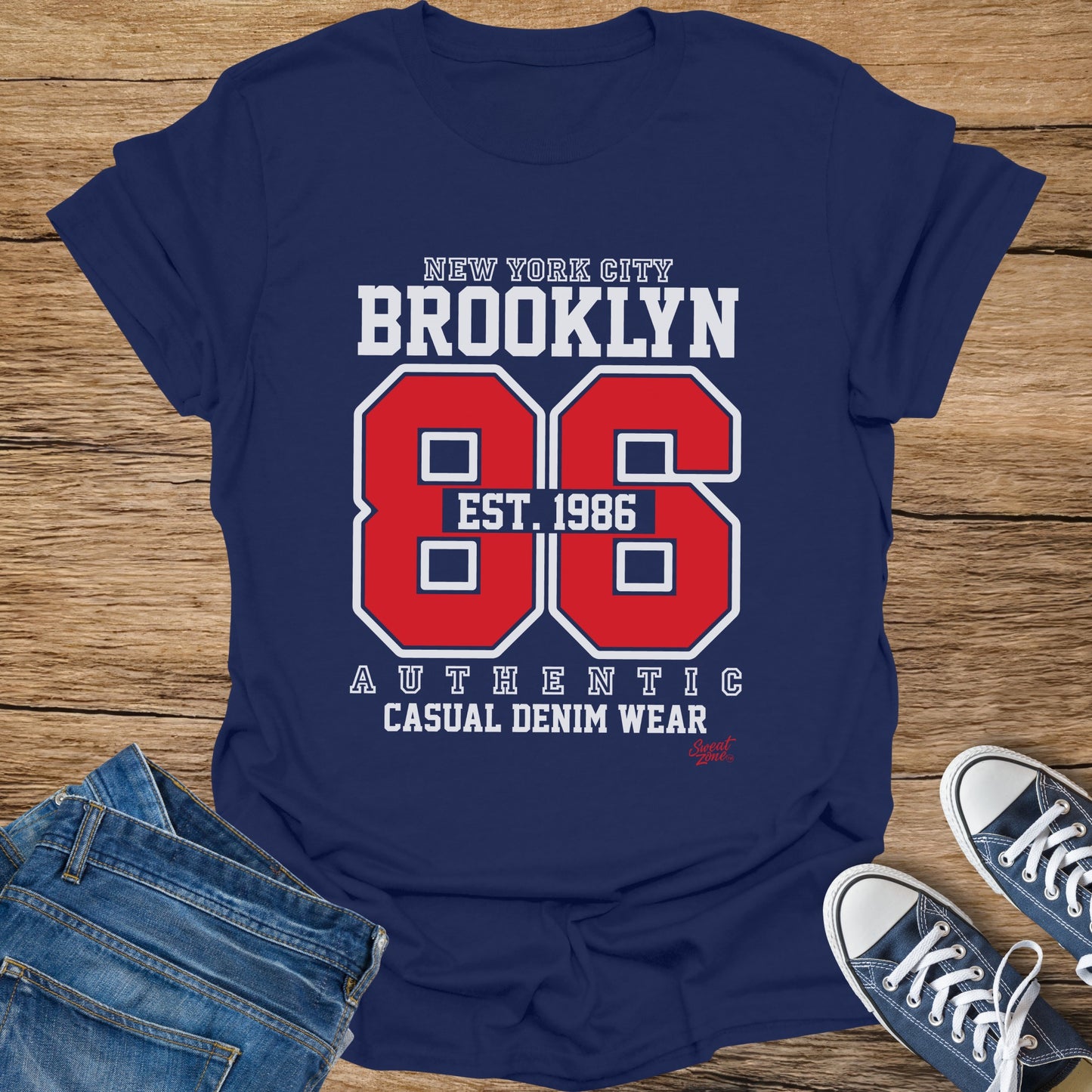 Navy t-shirt with "Brooklyn 86" graphic, "Est. 1986", and "Authentic Casual Denim Wear".