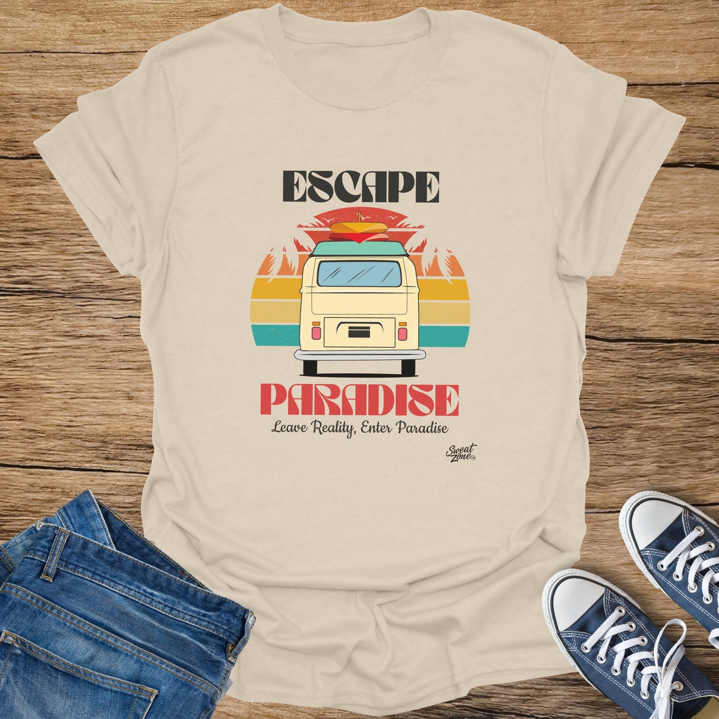 Cream t-shirt with "ESCAPE PARADISE" graphic featuring a van and sunset.