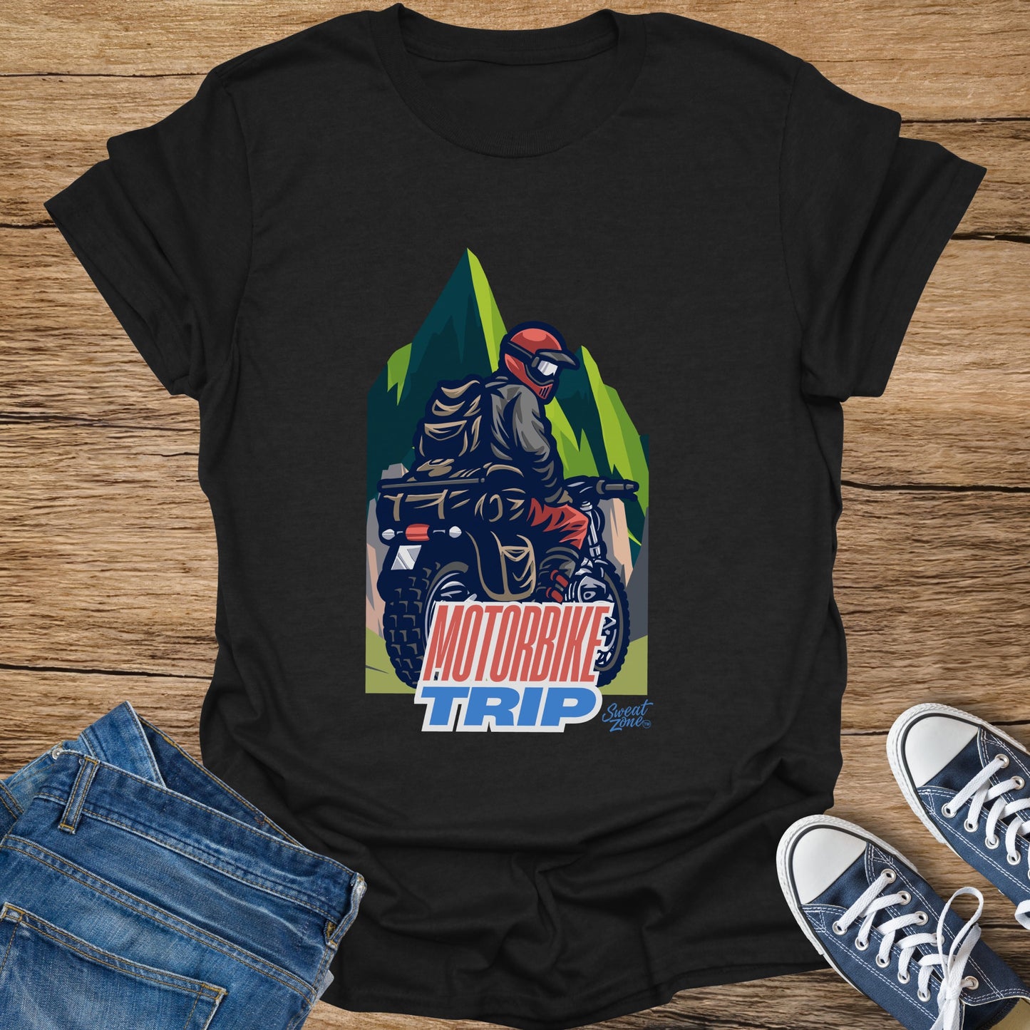 Black t-shirt with "MOTORBIKE TRIP" graphic and a person riding a motorbike.