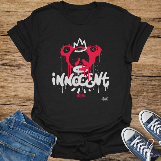 Black t-shirt with graffiti-style red and white "INNOCENT" text and drippy face graphic.