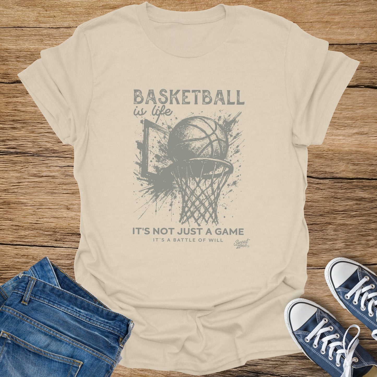 Light tan t-shirt with distressed graphic of basketball dunk and text "Basketball is life. It's not just a game. It's a battle of will."