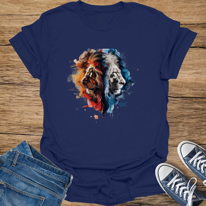 Navy t-shirt with a watercolor lion graphic split into fiery red and cool blue halves.