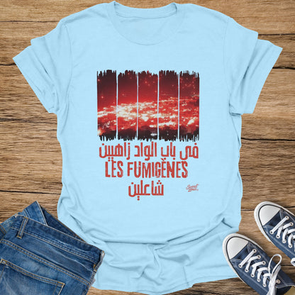 Light blue t-shirt with red graphic text and imagery of city lights.
