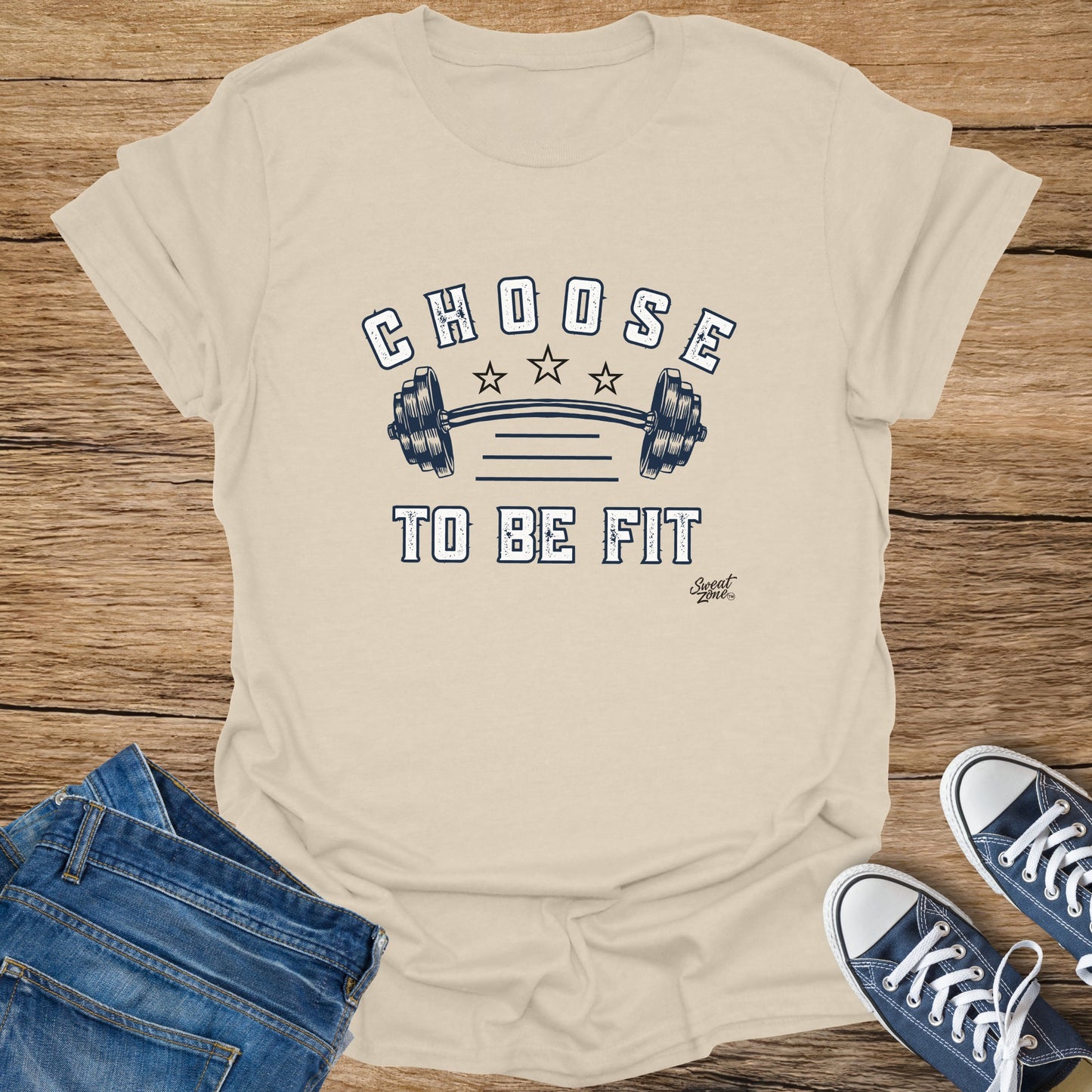 Beige t-shirt with "CHOOSE TO BE FIT" and barbell graphic.