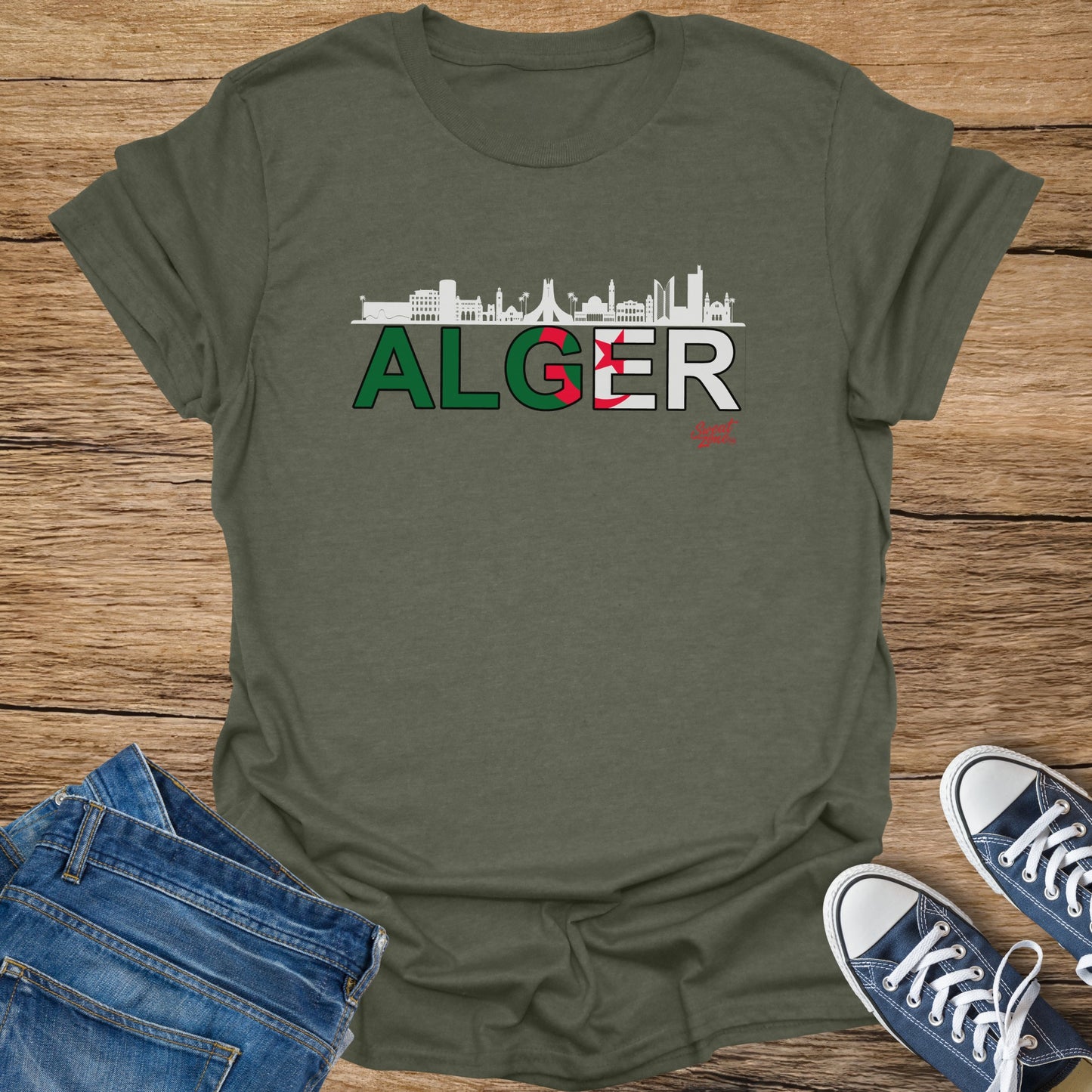 Green t-shirt with "ALGER" text and Algerian flag colors, featuring a skyline.