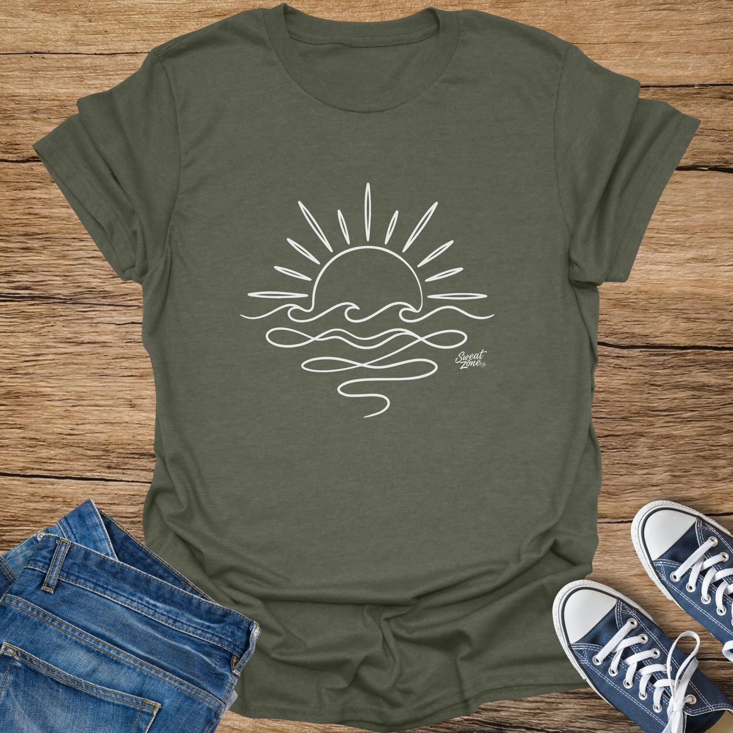 Green t-shirt with white line art of a sun and waves.