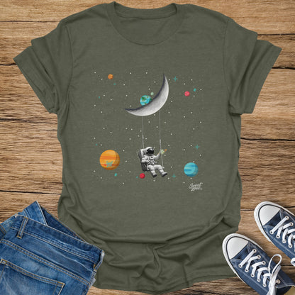 Astronaut on a swing tied to a crescent moon with planets and stars.