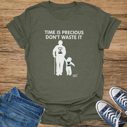 Olive green t-shirt with white text "TIME IS PRECIOUS DON'T WASTE IT" and silhouettes.