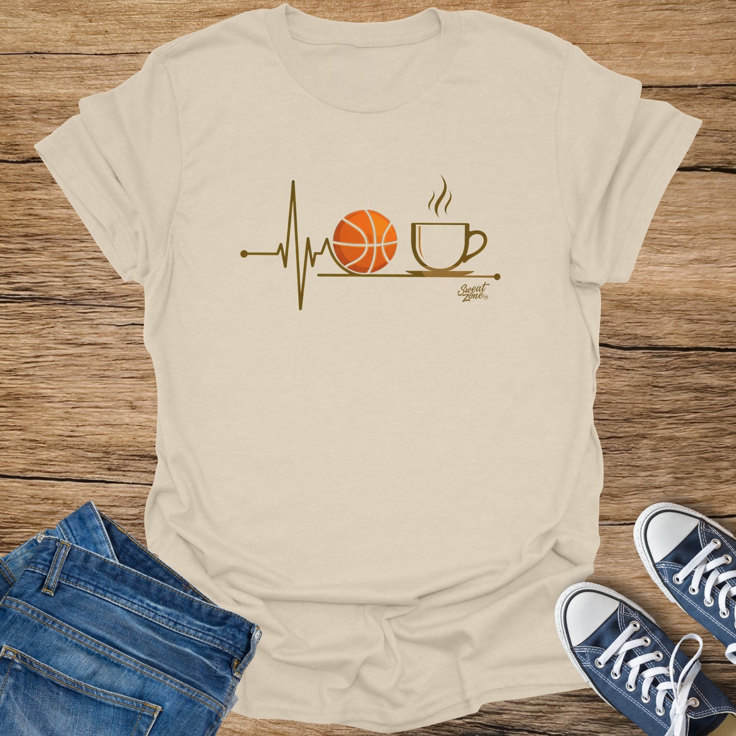 Cream t-shirt with basketball and coffee cup graphic and "Sweat Zone" logo.
