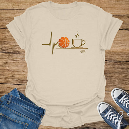 Cream t-shirt with basketball and coffee cup graphic and "Sweat Zone" logo.