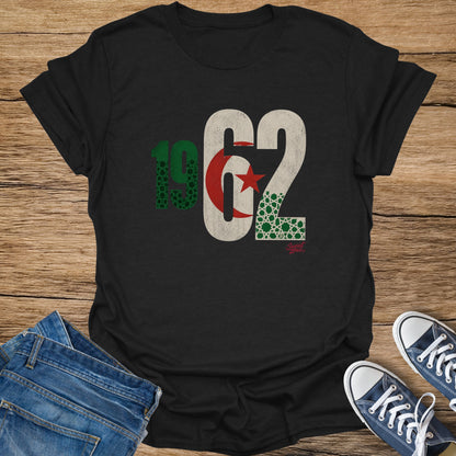 Black t-shirt with "1962" printed in distressed green and white, featuring Algerian flag elements.