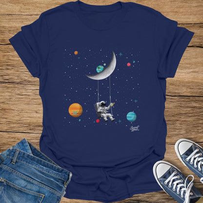 Astronaut on a swing beneath a crescent moon in star-filled space.
