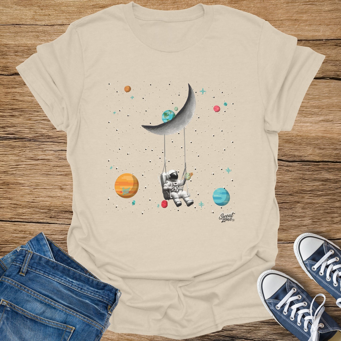 Astronaut swinging on moon with planets and stars, logo "Sweat Zone"