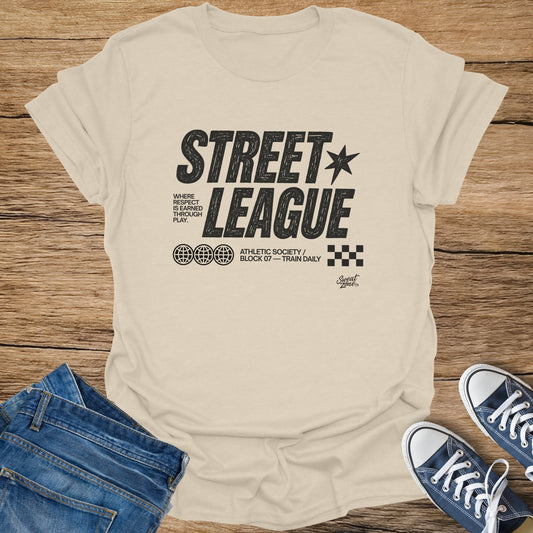 Beige t-shirt with "STREET LEAGUE" graphic, globes, and checkered square.