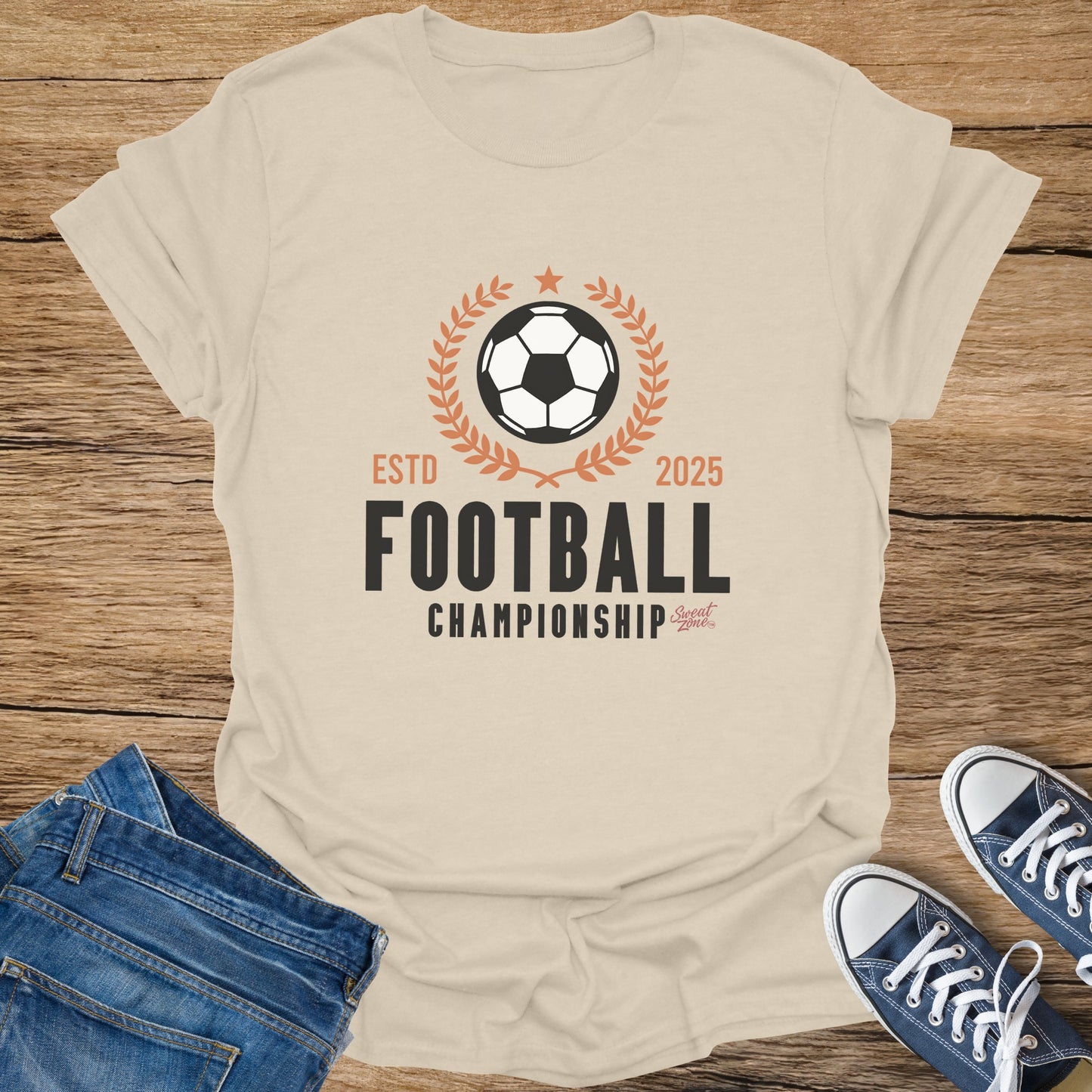 Light tan t-shirt with "Football Championship" graphic and a soccer ball and laurel wreath.