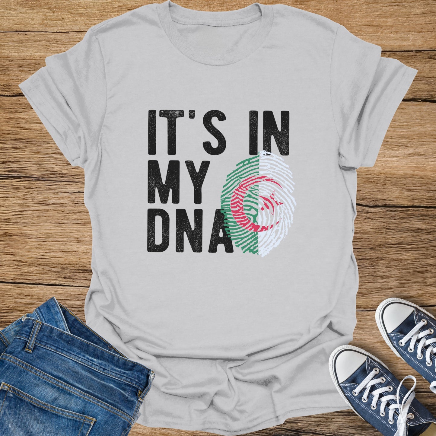 Gray t-shirt with "IT'S IN MY DNA" and Algerian flag fingerprint graphic.
