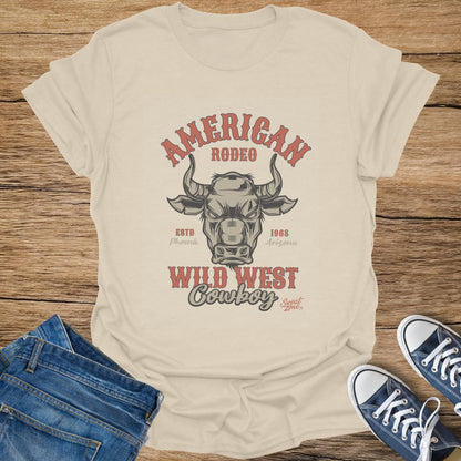 Fawn t-shirt with "American Rodeo" and a bull graphic, "Wild West Cowboy" text.