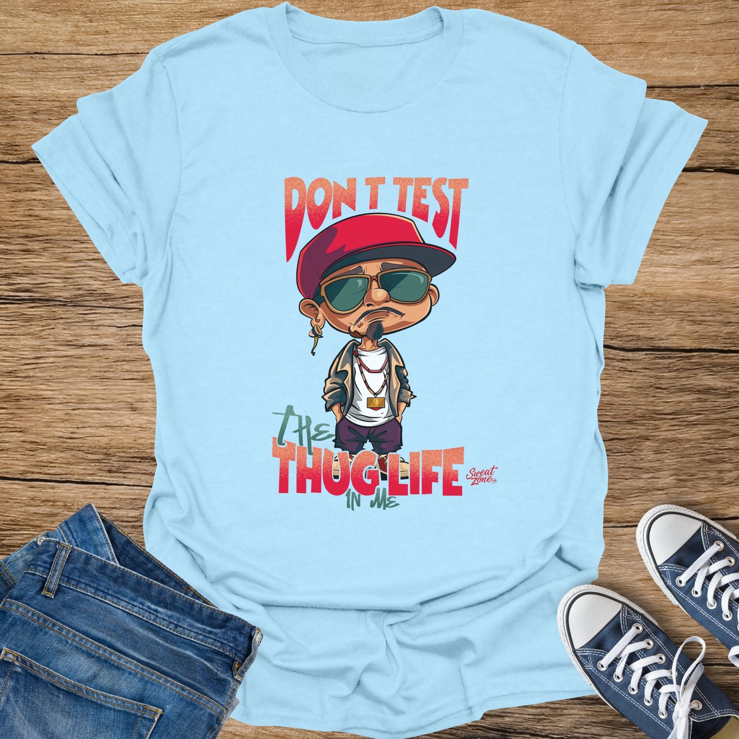 Light blue t-shirt with cartoon man and text "Don't test thug life in me".