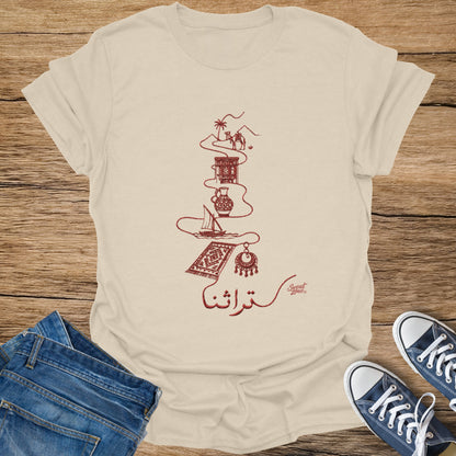 Beige t-shirt with red line art of a camel, jug, boat, rug, and earring.