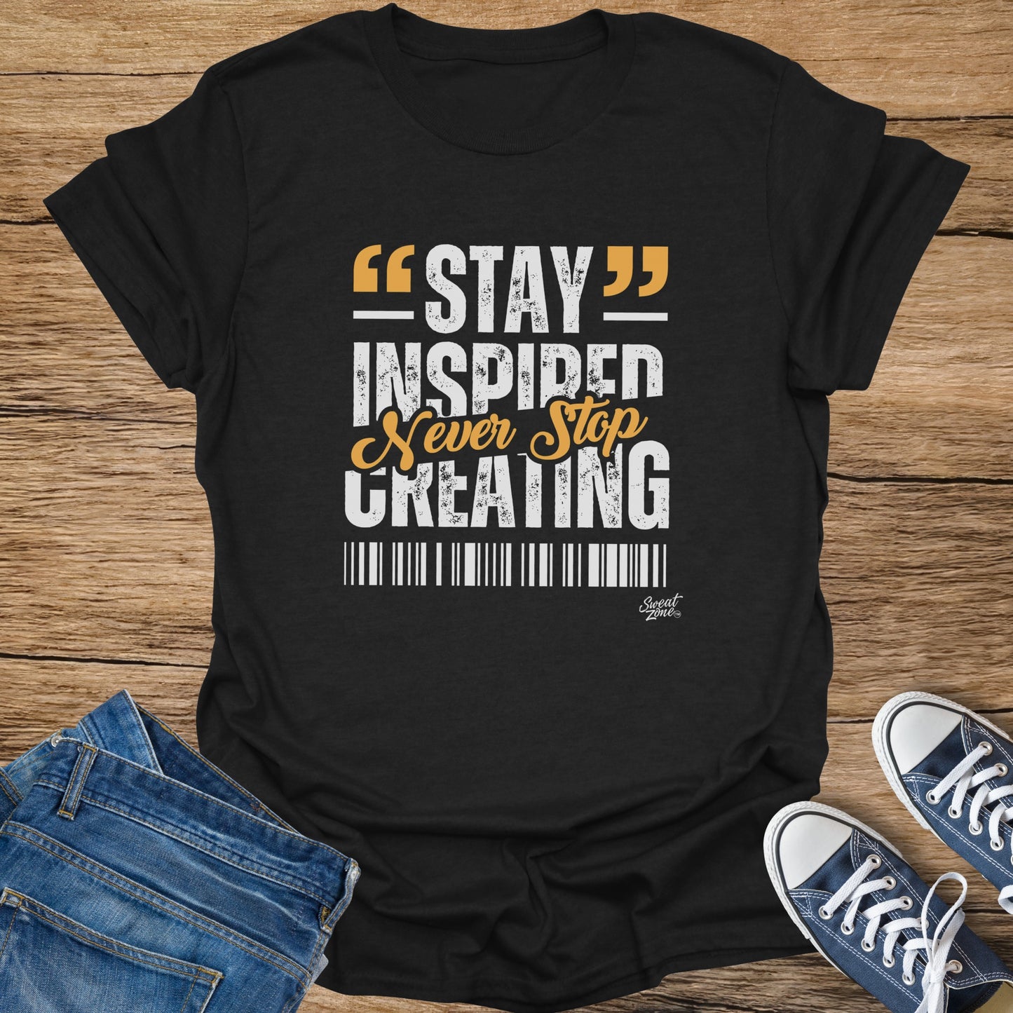 Black t-shirt with "STAY INSPIRED Never Stop CREATING" text and Sweat Zone logo.