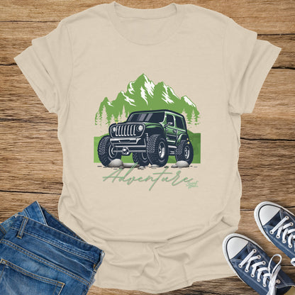 Graphic t-shirt with green off-road jeep, mountains, trees, and text "Adventure".