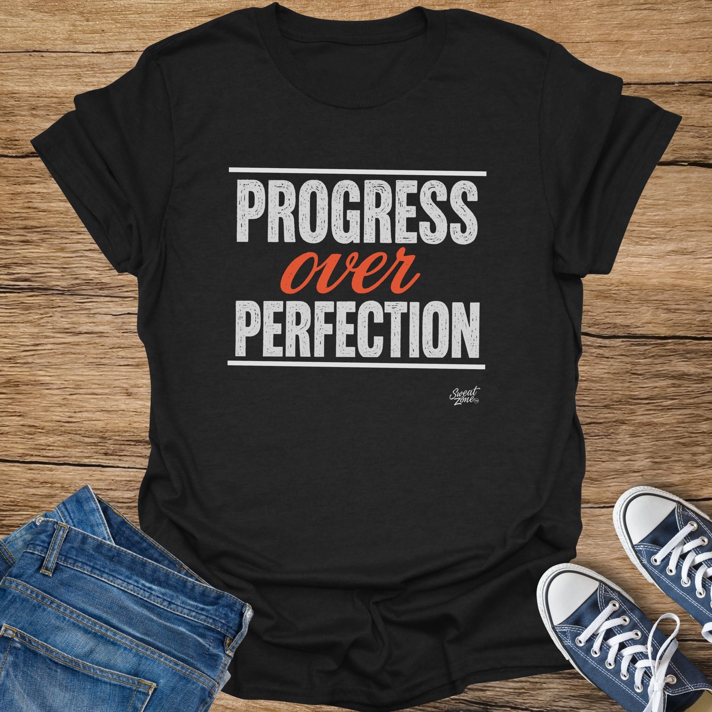 Black t-shirt with "Progress over PERFECTION" text and "Sweat Zone" logo.