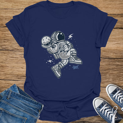 Navy t-shirt with a cartoon astronaut holding the moon, with "Sweat Zone" logo.