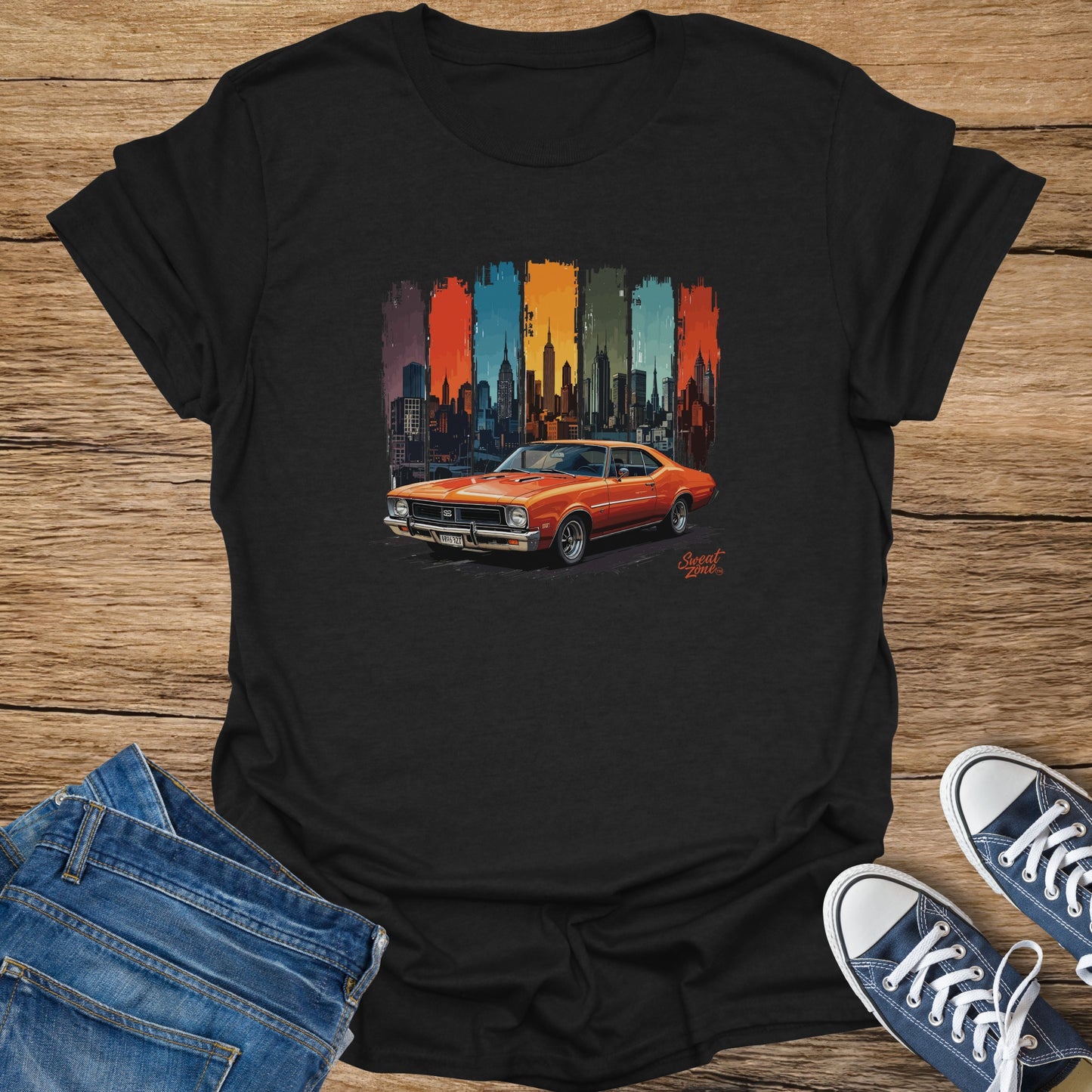 Orange muscle car in front of a colorful, stylized city skyline with "Sweat Zone" text.